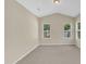 Bedroom featuring two windows and neutral carpet at 2513 Asher View Ct, Raleigh, NC 27606