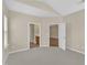Bedroom showcasing neutral tones, carpet flooring, and access to an en-suite bathroom at 2513 Asher View Ct, Raleigh, NC 27606