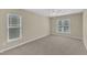 Empty bedroom featuring carpeted flooring, neutral paint, and natural light at 2513 Asher View Ct, Raleigh, NC 27606