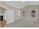 Bedroom featuring carpet floors, natural light, and a fireplace at 2513 Asher View Ct, Raleigh, NC 27606