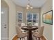 Cozy dining room with dark wood table, upholstered chairs, and bright natural light at 2513 Asher View Ct, Raleigh, NC 27606