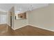 Dining area with wood floors, chandelier, and easy kitchen access at 2513 Asher View Ct, Raleigh, NC 27606