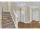 Foyer featuring hardwood floors, stairs, and a welcoming front entrance at 2513 Asher View Ct, Raleigh, NC 27606