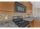 Modern kitchen with stainless steel appliances, patterned backsplash, and laminate countertops at 2513 Asher View Ct, Raleigh, NC 27606
