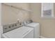 Laundry room featuring washer and dryer with shelving for storage at 2513 Asher View Ct, Raleigh, NC 27606