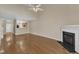 Open floor plan featuring living room with hardwood floors and fireplace at 2513 Asher View Ct, Raleigh, NC 27606