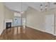 Vaulted living room with fireplace and french doors to the backyard at 2513 Asher View Ct, Raleigh, NC 27606