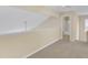 Loft room featuring neutral paint, carpet, and entry to an adjacent bathroom at 2513 Asher View Ct, Raleigh, NC 27606
