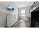 Cozy bedroom featuring a TV, closet, and plenty of natural light at 2620 Holloway St, Durham, NC 27703