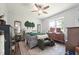 Spacious bedroom featuring a large window, ceiling fan, and stylish decor at 2620 Holloway St, Durham, NC 27703