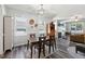Bright dining area with hardwood floors, natural light, and modern decor at 2620 Holloway St, Durham, NC 27703