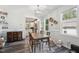 Cozy dining room with a wooden table, chandelier, and views into the adjacent kitchen at 2620 Holloway St, Durham, NC 27703