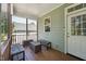 Inviting front porch with cozy wooden benches and a well-maintained entrance perfect for relaxing and receiving guests at 2620 Holloway St, Durham, NC 27703