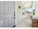Inviting front porch features a stylish gray door, with view of the home's well-manicured exterior at 2620 Holloway St, Durham, NC 27703