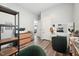 Open office area featuring a makeup vanity, a comfortable chair, and access to other rooms in the home at 2620 Holloway St, Durham, NC 27703