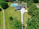 Stunning aerial view of a property featuring a long driveway and a serene backyard at 2709 Les Paul Ln, Apex, NC 27539