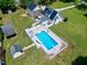 Aerial view of a home with a pool, backyard, and solar panels at 2709 Les Paul Ln, Apex, NC 27539