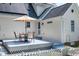 Spacious backyard features patio set for relaxing, solar panels and white fence at 2709 Les Paul Ln, Apex, NC 27539