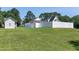 Expansive backyard featuring a pristine white fence, offering privacy and charm at 2709 Les Paul Ln, Apex, NC 27539