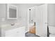 Neutral bathroom featuring white vanity and fixtures with view to hall at 2709 Les Paul Ln, Apex, NC 27539