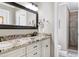 Bathroom vanity with black faucet and decorative mirror at 2709 Les Paul Ln, Apex, NC 27539