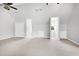 Bright bonus room featuring neutral paint, carpeted floors, closet, and unique architectural details at 2709 Les Paul Ln, Apex, NC 27539