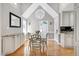 Elegant dining room with vaulted ceilings, hardwood floors, and octagonal window at 2709 Les Paul Ln, Apex, NC 27539
