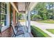Inviting covered front porch with seating area at 2709 Les Paul Ln, Apex, NC 27539