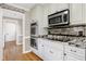 Modern kitchen with stainless steel appliances, stylish backsplash, and a double oven at 2709 Les Paul Ln, Apex, NC 27539