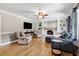 Bright living room with fireplace, built-in shelves and hardwood floors at 2709 Les Paul Ln, Apex, NC 27539