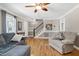 Inviting living room with hardwood floors, a staircase, and neutral decor at 2709 Les Paul Ln, Apex, NC 27539