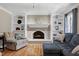 Cozy living room featuring a fireplace, built-ins, and comfortable seating at 2709 Les Paul Ln, Apex, NC 27539