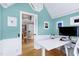 Open concept office space features a built-in workstation and light-filled dining room at 2709 Les Paul Ln, Apex, NC 27539