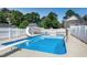 Sparkling pool with a diving board and slide in a fenced yard at 2709 Les Paul Ln, Apex, NC 27539