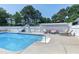 Beautiful pool with a slide and patio furniture, perfect for relaxation and entertainment at 2709 Les Paul Ln, Apex, NC 27539