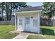 Quaint shed featuring a single door, multiple windows, and a well-maintained exterior at 2709 Les Paul Ln, Apex, NC 27539