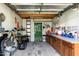 Organized shed interior featuring a workbench, pegboard, and shelving for tools and equipment at 2709 Les Paul Ln, Apex, NC 27539