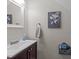 Bathroom with sink, cabinet, and towel ring against a neutral wall at 2901 Ceremonial Ct, Raleigh, NC 27615