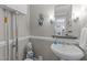 Cozy powder room features pedestal sink, decorative mirror, and elegant sconces at 2901 Ceremonial Ct, Raleigh, NC 27615