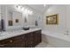 Elegant bathroom with double sinks, granite countertops, and a luxurious soaking tub at 2901 Ceremonial Ct, Raleigh, NC 27615