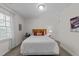 Bright bedroom with natural light features a comfortable bed and side tables with lamps at 2901 Ceremonial Ct, Raleigh, NC 27615