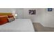 Bedroom with a comfortable bed and warm-toned pillows and artwork at 2901 Ceremonial Ct, Raleigh, NC 27615