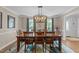 Formal dining room with hardwood floors and views of the outdoor scenery at 2901 Ceremonial Ct, Raleigh, NC 27615