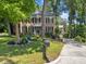 Traditional brick home with a well-manicured lawn, mature trees, and inviting curb appeal at 2901 Ceremonial Ct, Raleigh, NC 27615