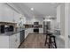 Modern kitchen with stainless steel appliances, granite countertops, and white cabinets at 2901 Ceremonial Ct, Raleigh, NC 27615