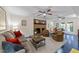 Spacious living room with fireplace, ceiling fans and neutral colored furniture at 2901 Ceremonial Ct, Raleigh, NC 27615