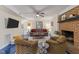Living room with fireplace, ceiling fan, neutral furniture, and ample space at 2901 Ceremonial Ct, Raleigh, NC 27615