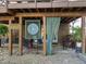 Cozy covered patio with wicker furniture and a serene, private setting at 2901 Ceremonial Ct, Raleigh, NC 27615