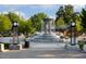 Charming town square featuring a tiered fountain, park benches, and lush greenery for community enjoyment at 2908 Kempthorne Rd # 53, Cary, NC 27519