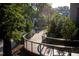Scenic community walking trail with lush greenery and a bridge, perfect for leisurely strolls and outdoor activities at 2908 Kempthorne Rd # 53, Cary, NC 27519